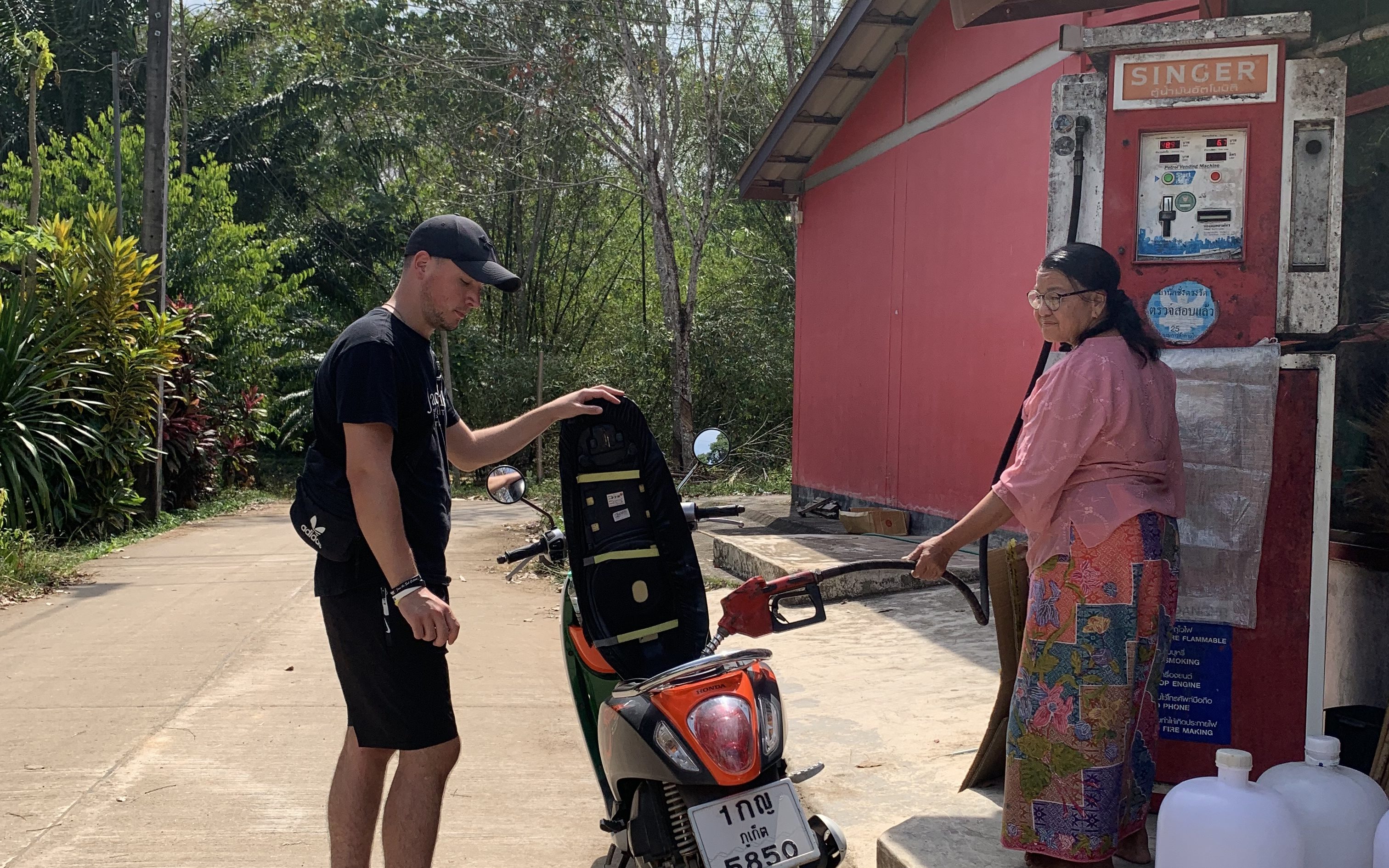 This image has an empty alt attribute; its file name is scooter-gas-edited.jpg